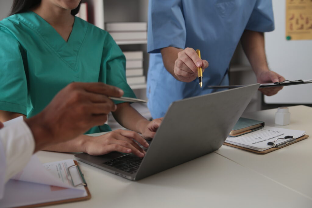 Healthcare professionals providing medical care in a modern hospital.
