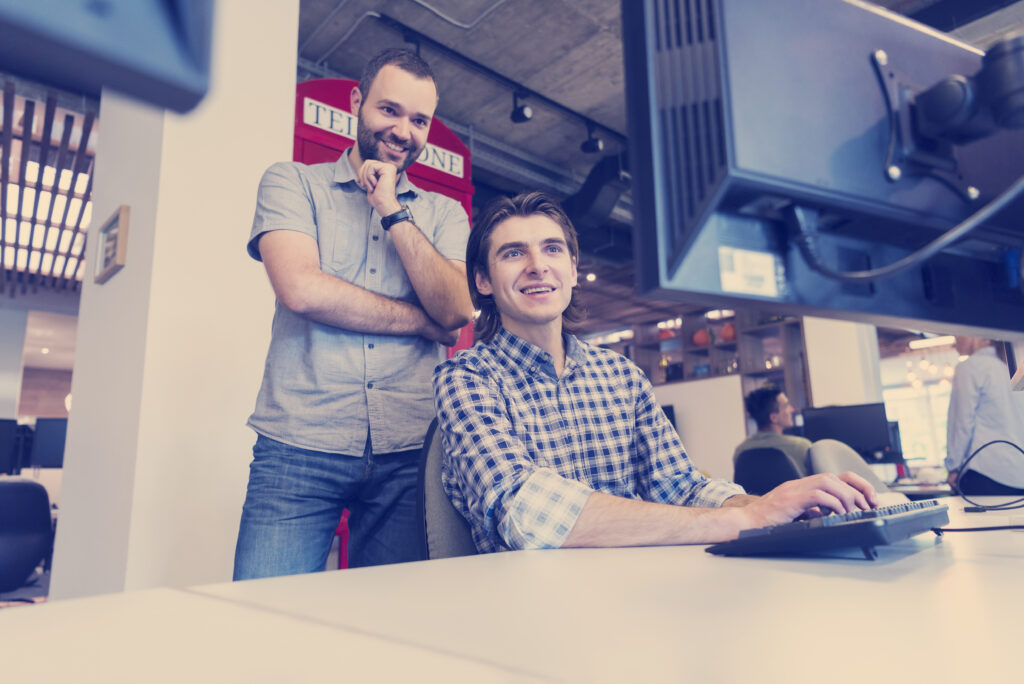 Tech industry professionals collaborating in an office